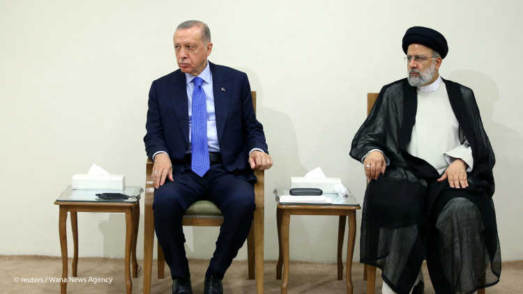Turkish President Recep Tayyip Erdogan sits next to Iranian President Ebrahim Raisi during a meeting with Supreme Leader Ayatollah Ali Khamenei (not pictured) in Tehran, Iran July 19, 2022.