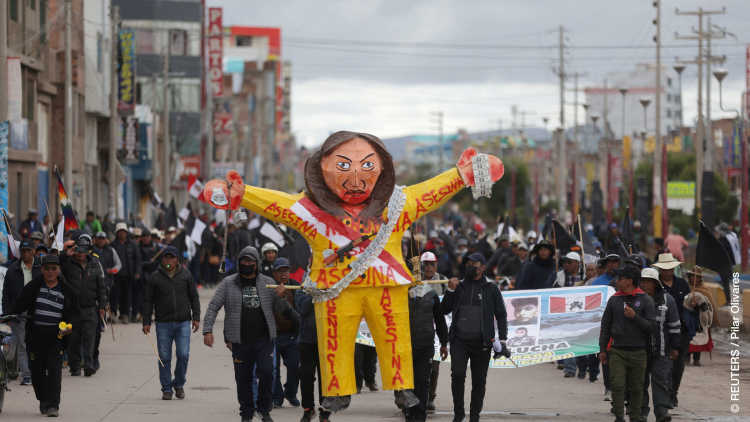 Anti-government demonstrators hold a puppet mocking Peru’s President Dina Boluarte, amid the worst wave of protests in at least two decades in the Andean country, in Juliaca, Peru February 9, 2023.