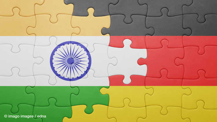 Puzzle with the national flag of germany and india. concept.