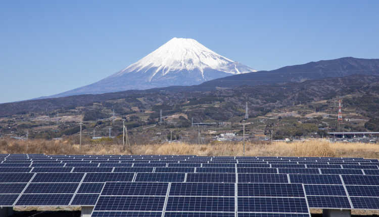 Photovoltaic plant with the snow-capped Fujiyama in the background.