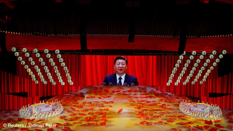 A screen shows Chinese President Xi Jinping during a show commemorating the 100th anniversary of the founding of the Communist Party of China at the National Stadium in Beijing