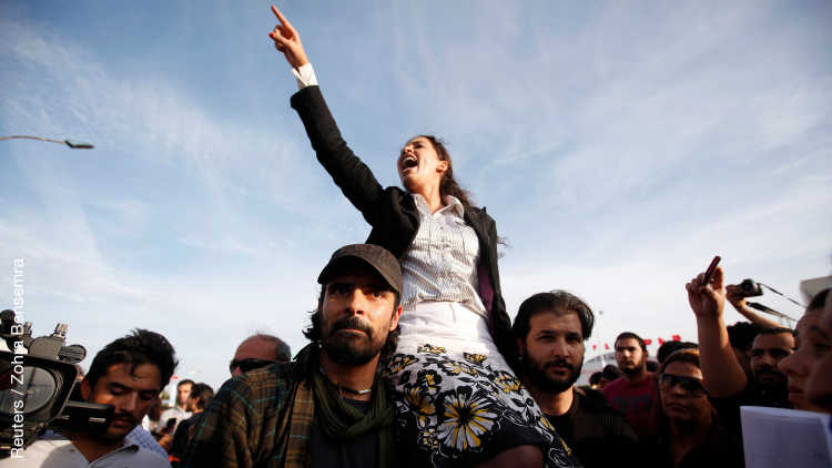 A demonstrator shouts during a protest against the Islamist Ennahda movement in Tunis