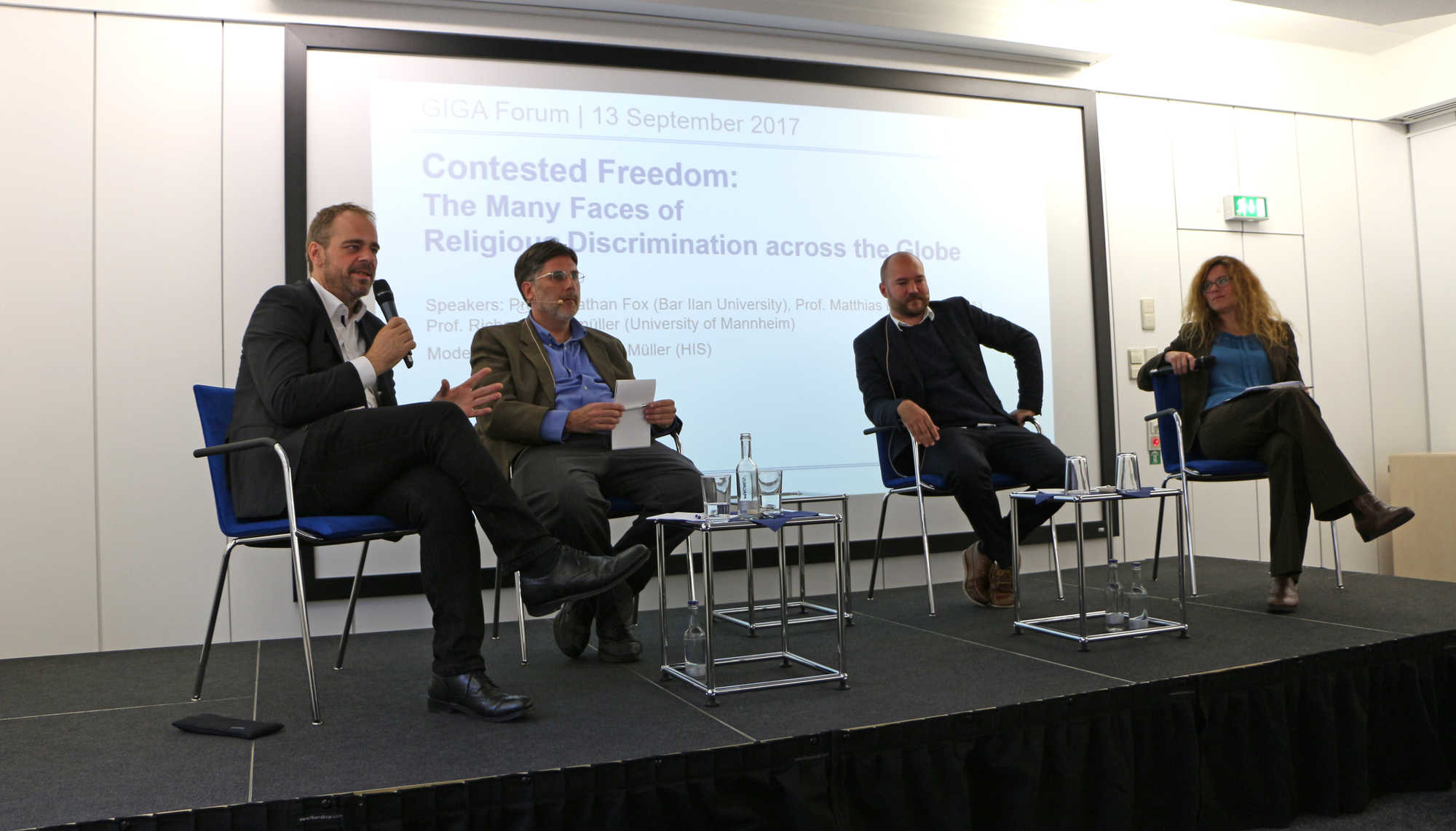Podium from left to right: Prof. Matthias Basedau, Prof. Jonathan Fox, Prof. Richard Traunmüller, Dr. Miriam M. Müller