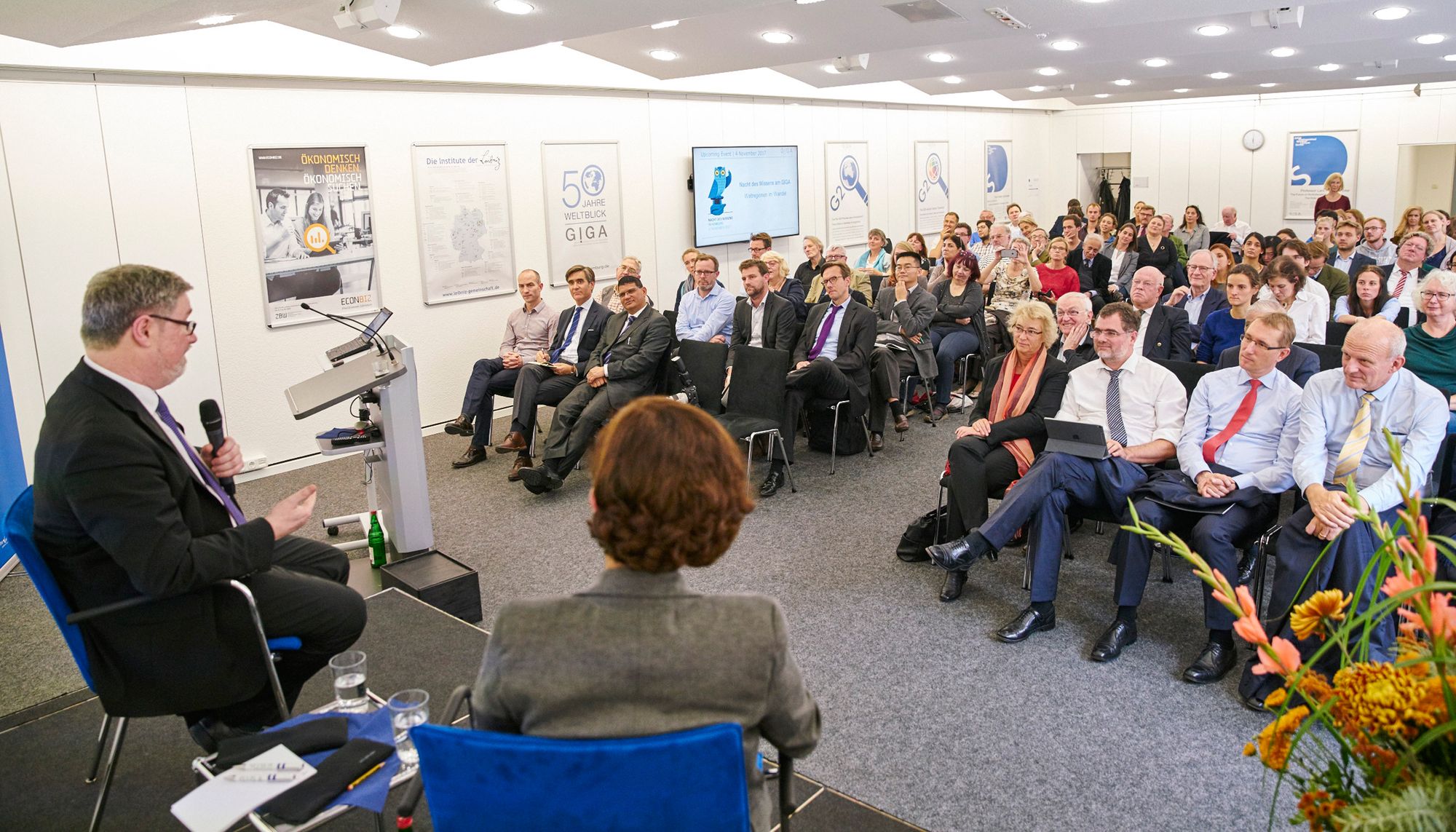 Picture of speaker and audience