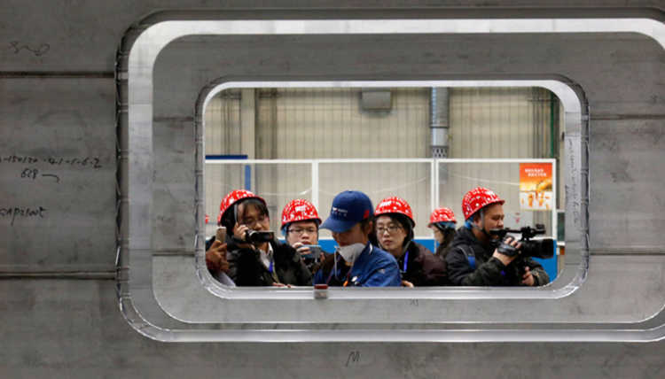 Journalists viewing construction of China CNR’s new high-speed train in Tangshan.