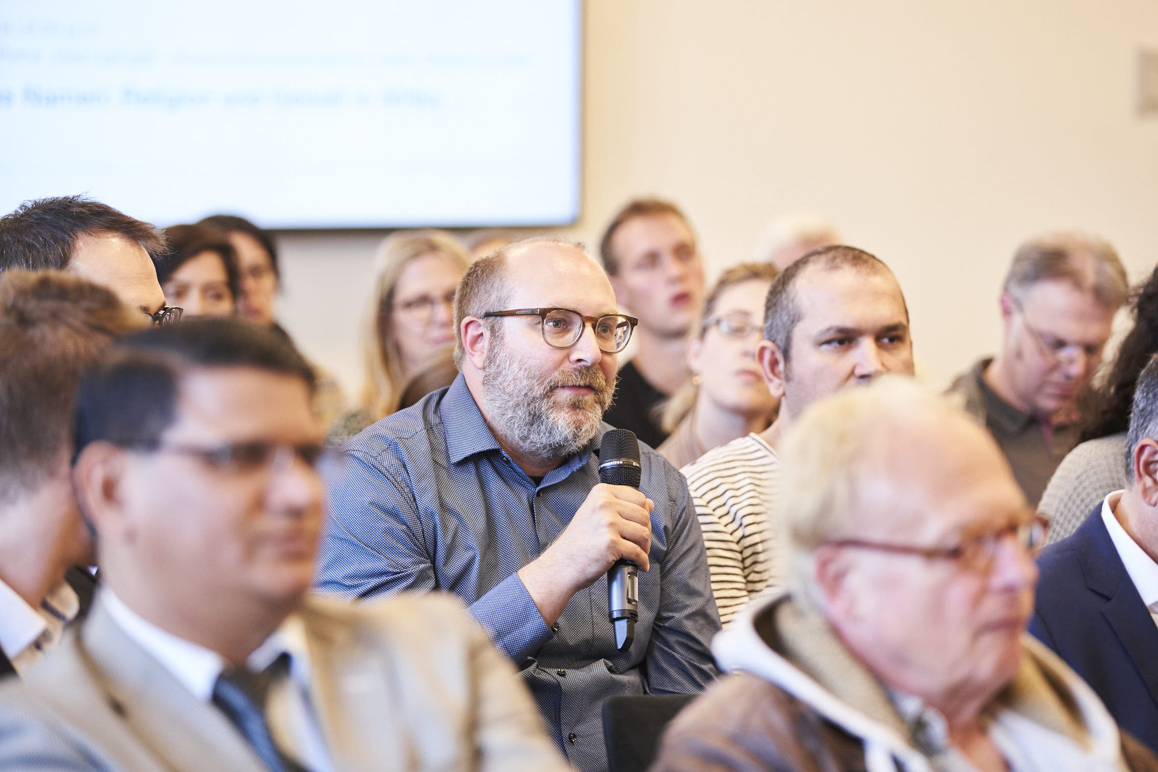 Picture of a person speaking in the audience