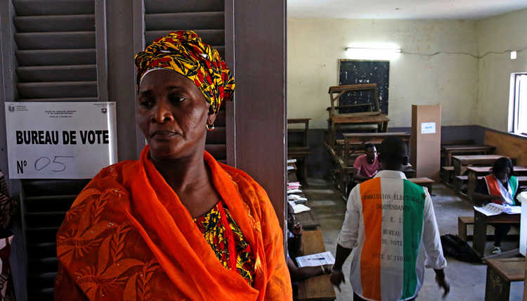 Woman in front of a election office in Ivory Coast