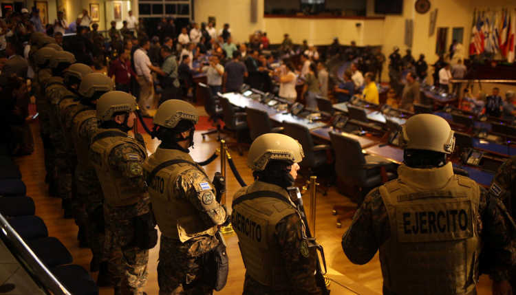 Armed soldiers stand in the National Congress of El Salvador.