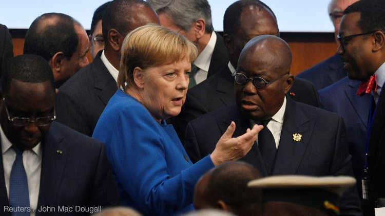 German Chancellor Angela Merkel talks with Ghana's President Nana Akufo-Addo.