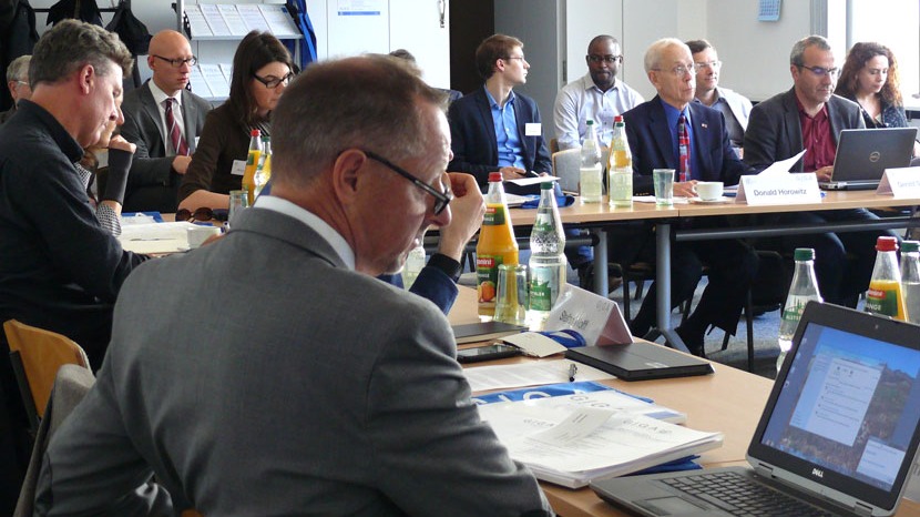 Members of the conference sit at the table