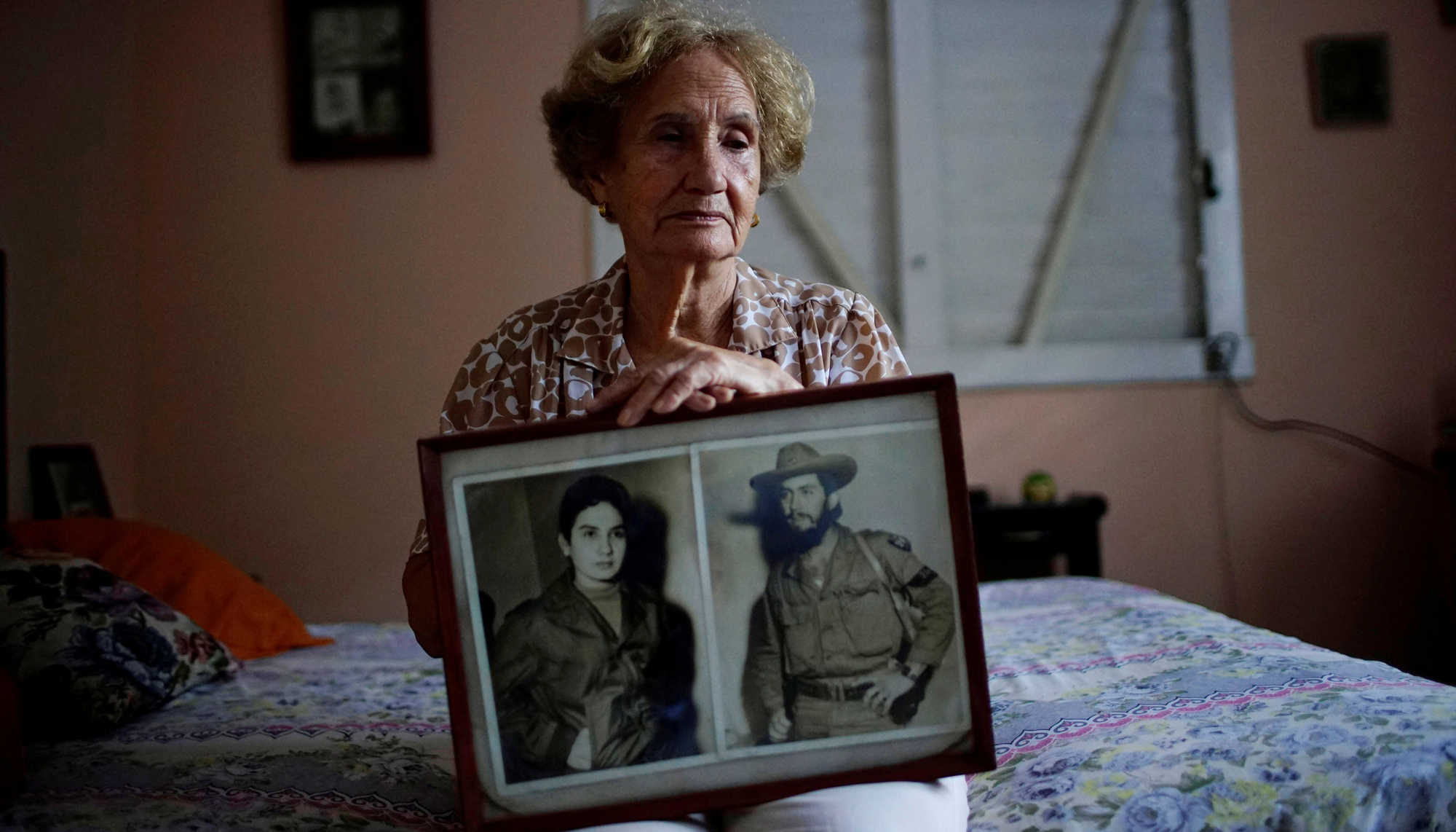 Picture of eldery woman carrying a picture