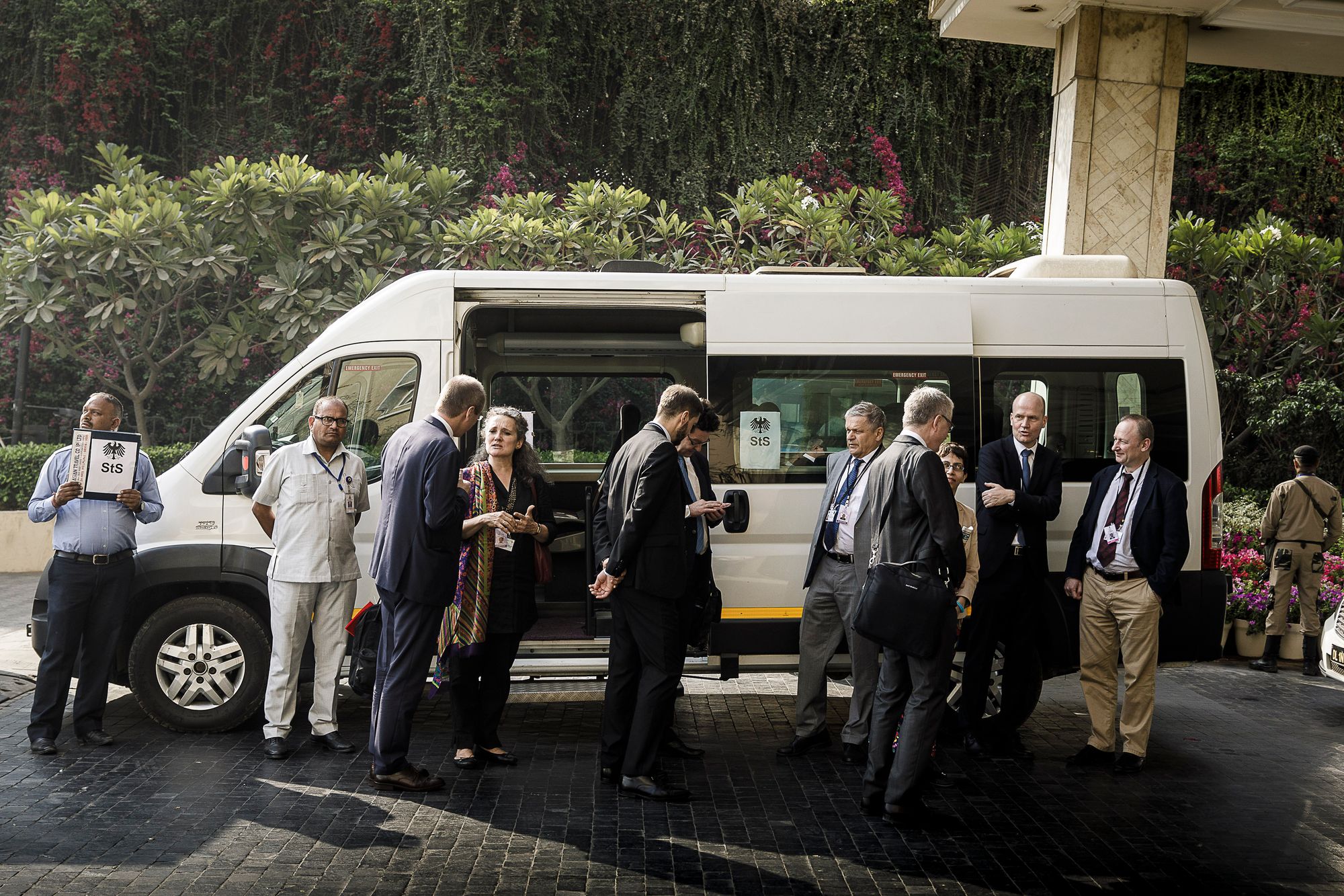 Picture of a group in front of a bus