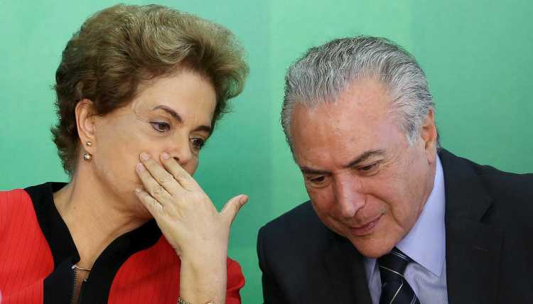 Brazil's President Dilma Rousseff talks to Vice President Michel Temer.