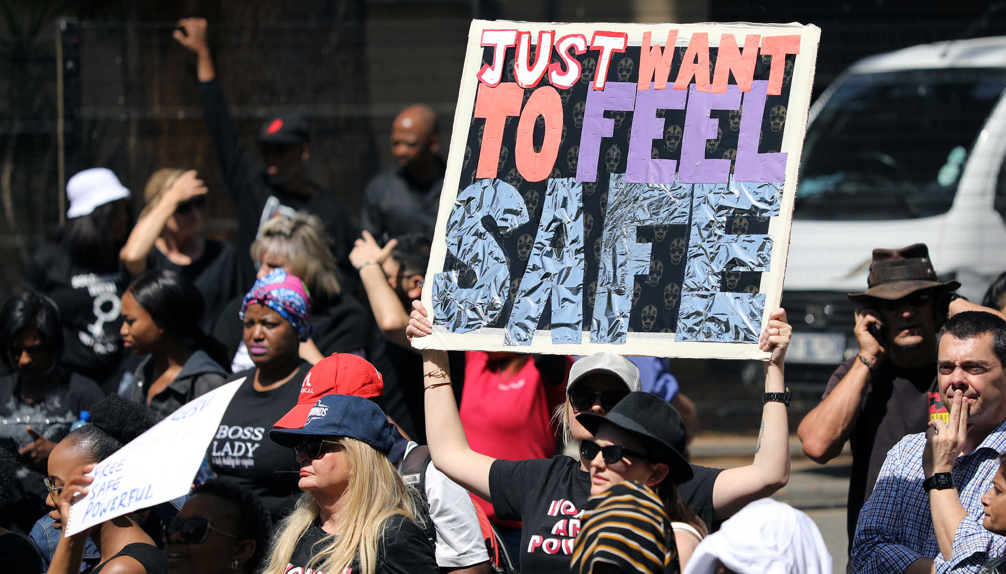  Demonstrators hold placard