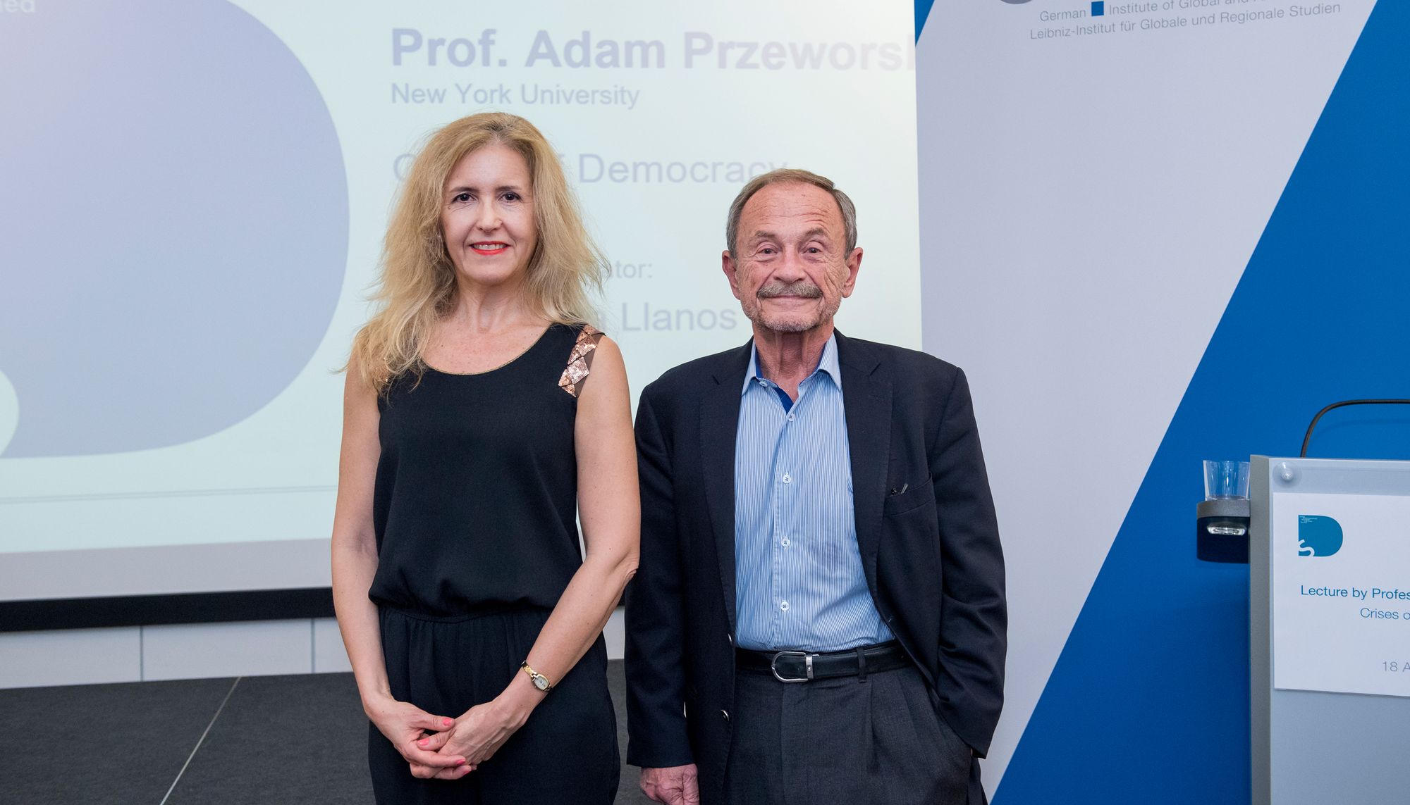 Picture of Przeworski and Llanos in front of the GIGA display unit