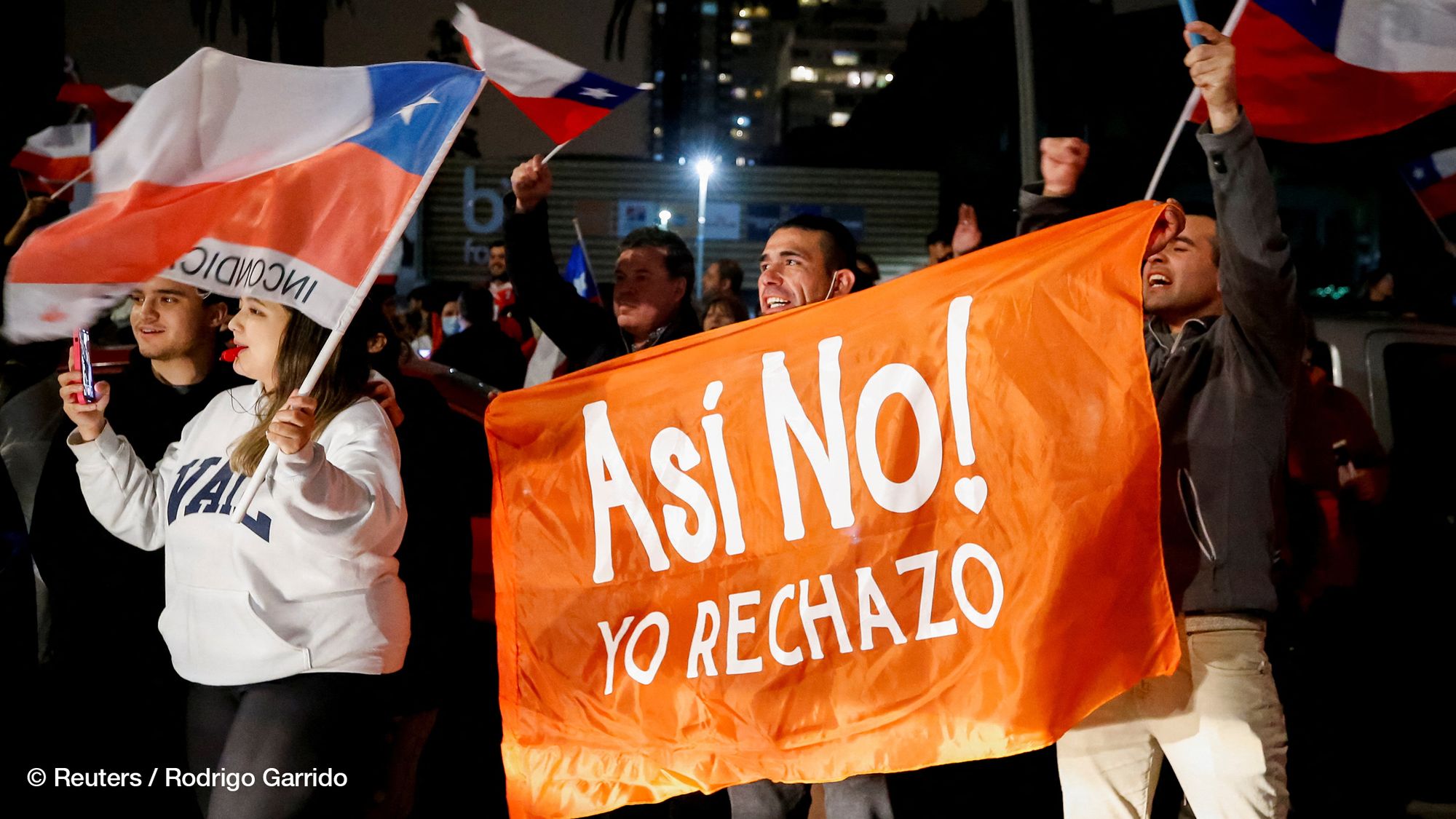 Supporters of "I Reject" option hold a banner that reads "Not like that! I Reject" as they react to early results of the referendum on a new Chilean constitution in Valparaiso, Chile, September 4, 2022