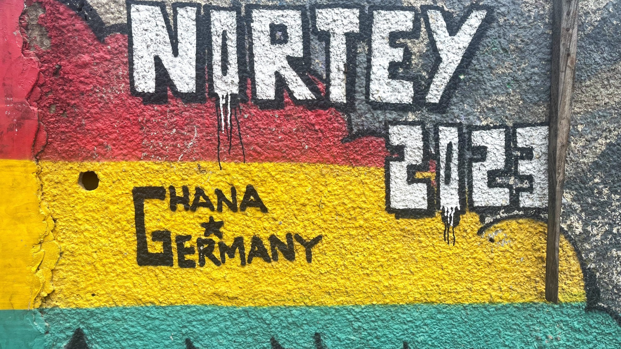Photo of a wall saying Ghana Germany