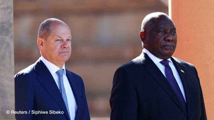 German Chancellor Olaf Scholz stands next to South African President Cyril Ramaphosa, before inspecting the guard of honour during his state visit to the governments Union building in Pretoria, South Africa May 24, 2022. REUTERS/Siphiwe Sibeko
