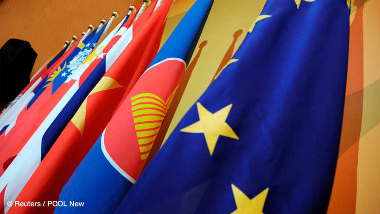 The flag of the European Union (R) stands beside the flag of the Association of the Southeast Asian Nations (ASEAN) and the flags of the 10-member countries during the ASEAN-EU ministerial meeting in Singapore