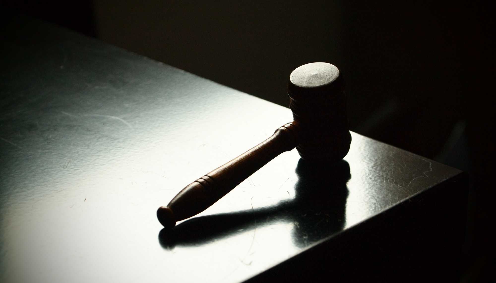 Judge's gavel lies on a table.