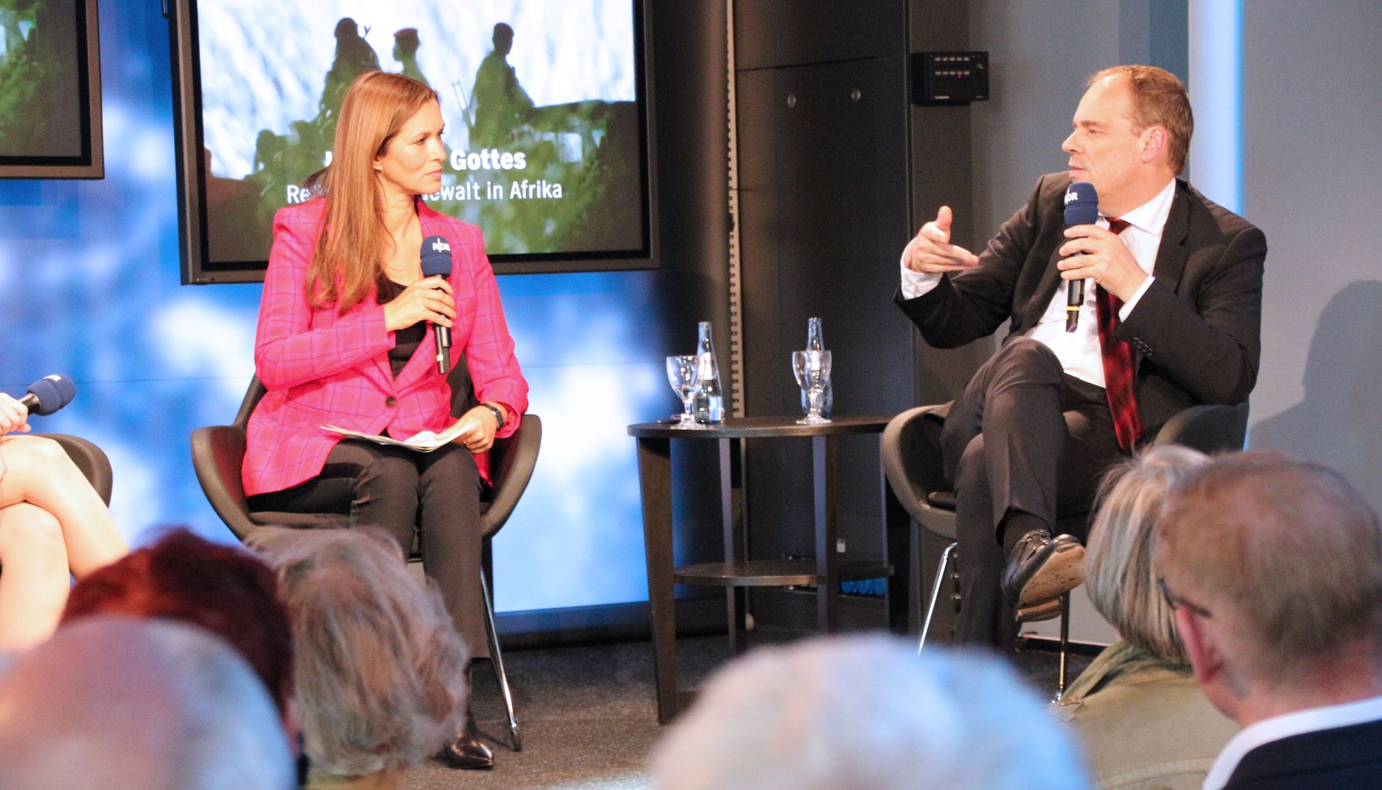 Prof. Dr. Matthias Basedau and  Julia-Niharika Sen at the panel discussion "In God's Name: Religion and Violence in Africa."