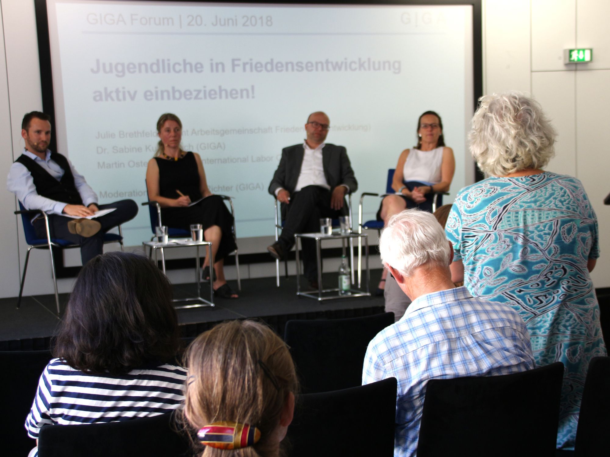 Someone from audience asking a question