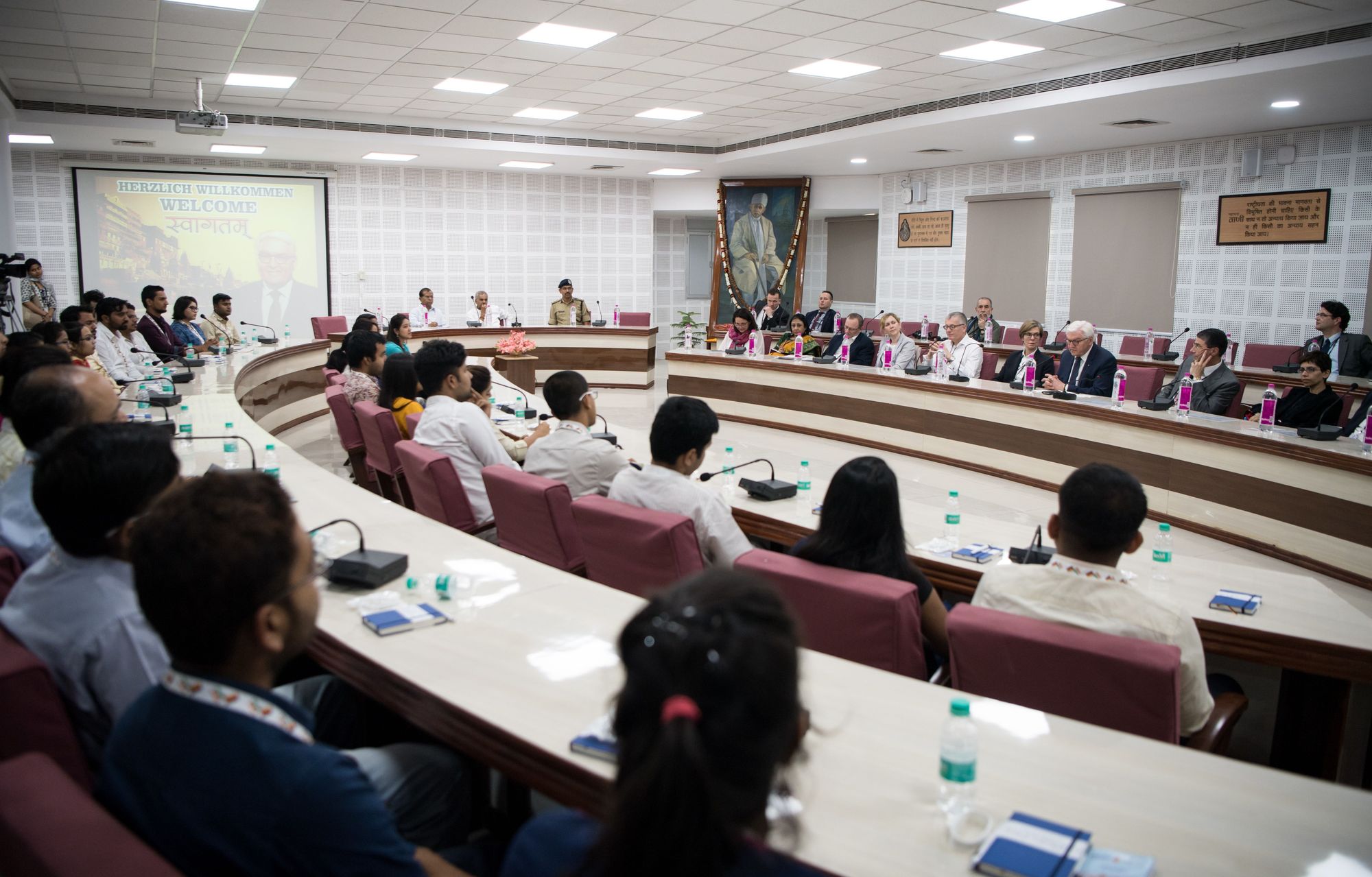 Picture of a lecture hall with students and speakers