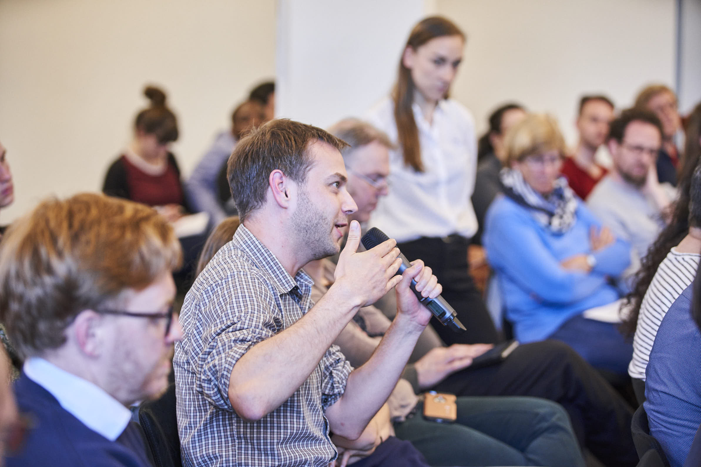 Picture of a person speaking in the audience