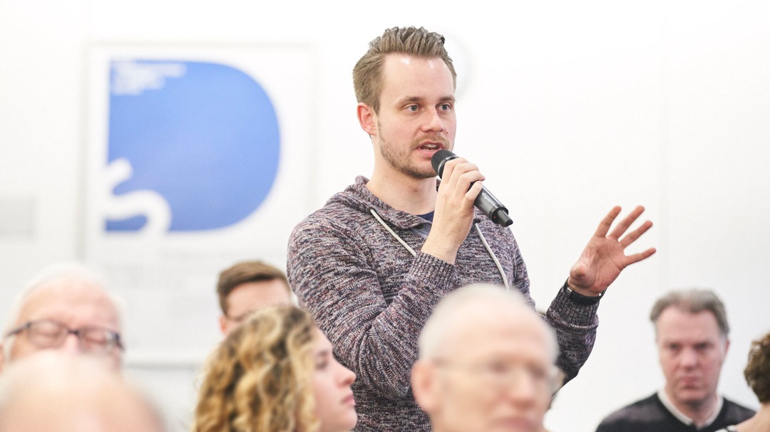 Picture of a visitor asking questions