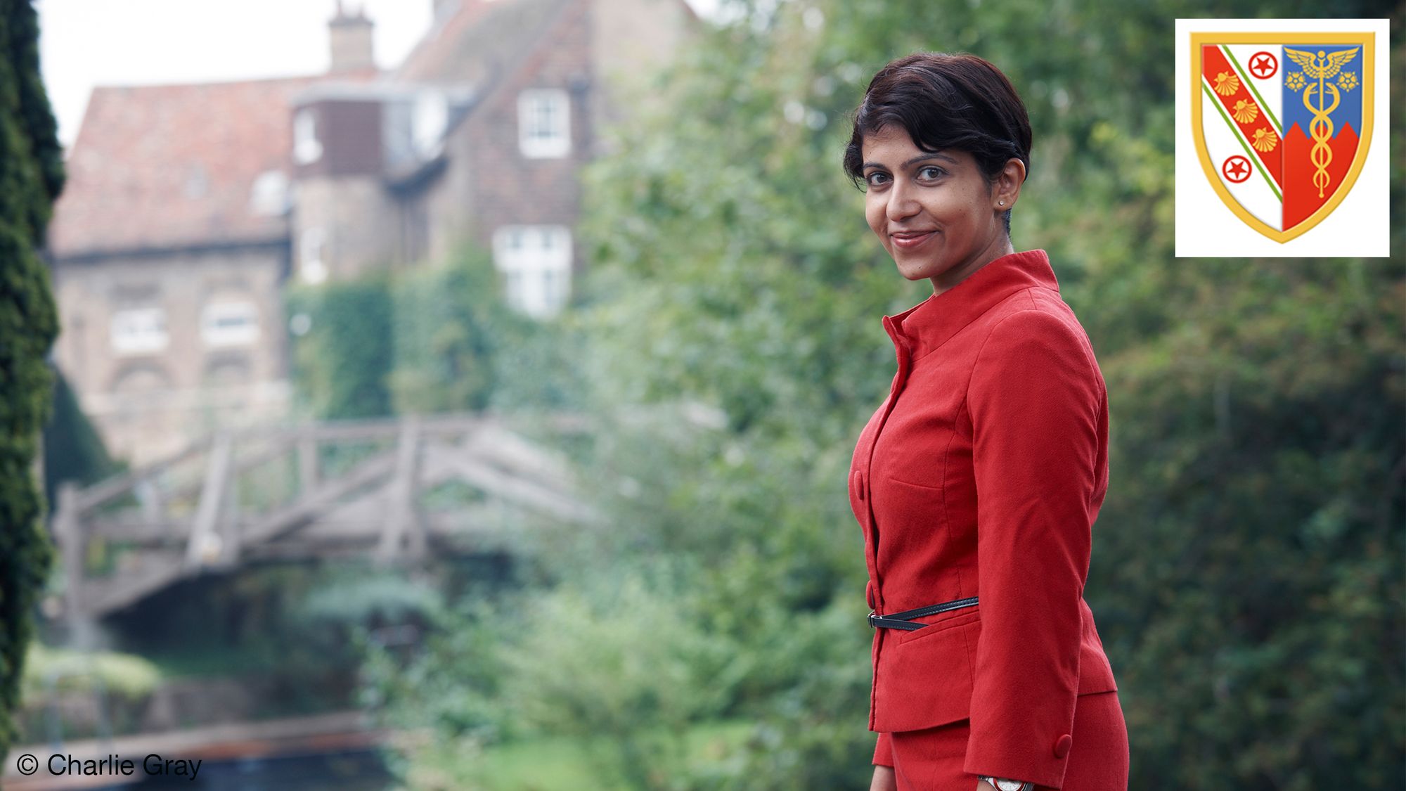 Prof. Dr Amrita Narlikar stands by a lake near Darwin College