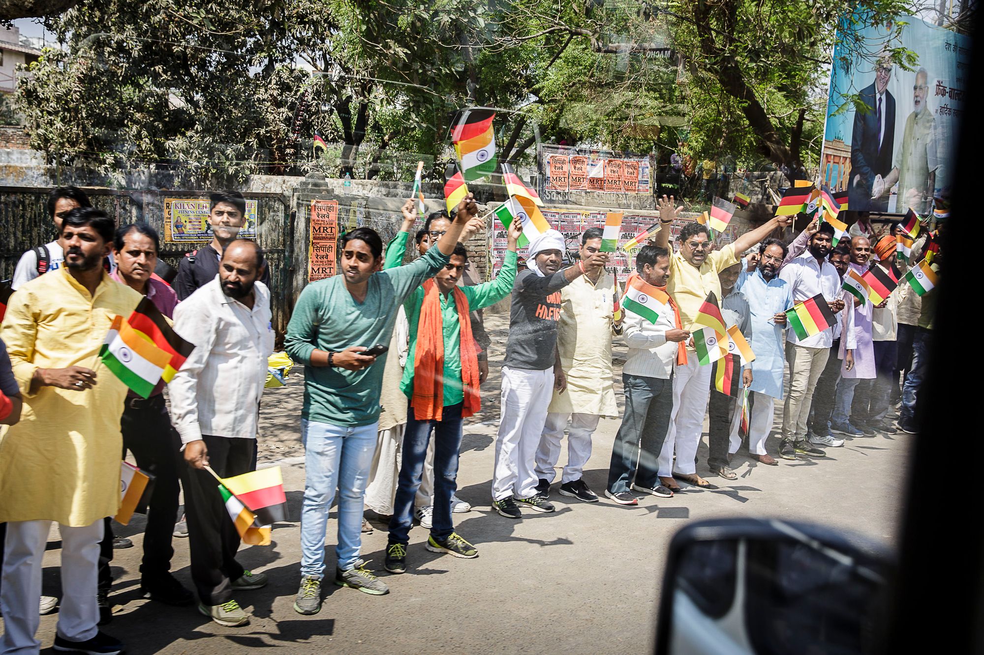 A group of people waving with flags