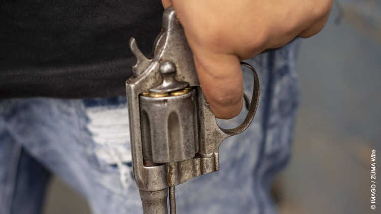 A Barrio 18 gang member holding a pistol in San Salvador. There are an estimated 60,000 gang members in El Salvador. Criminal youth gangs dominate life in El Salvador, which has one of the highest murder rates in the world. 