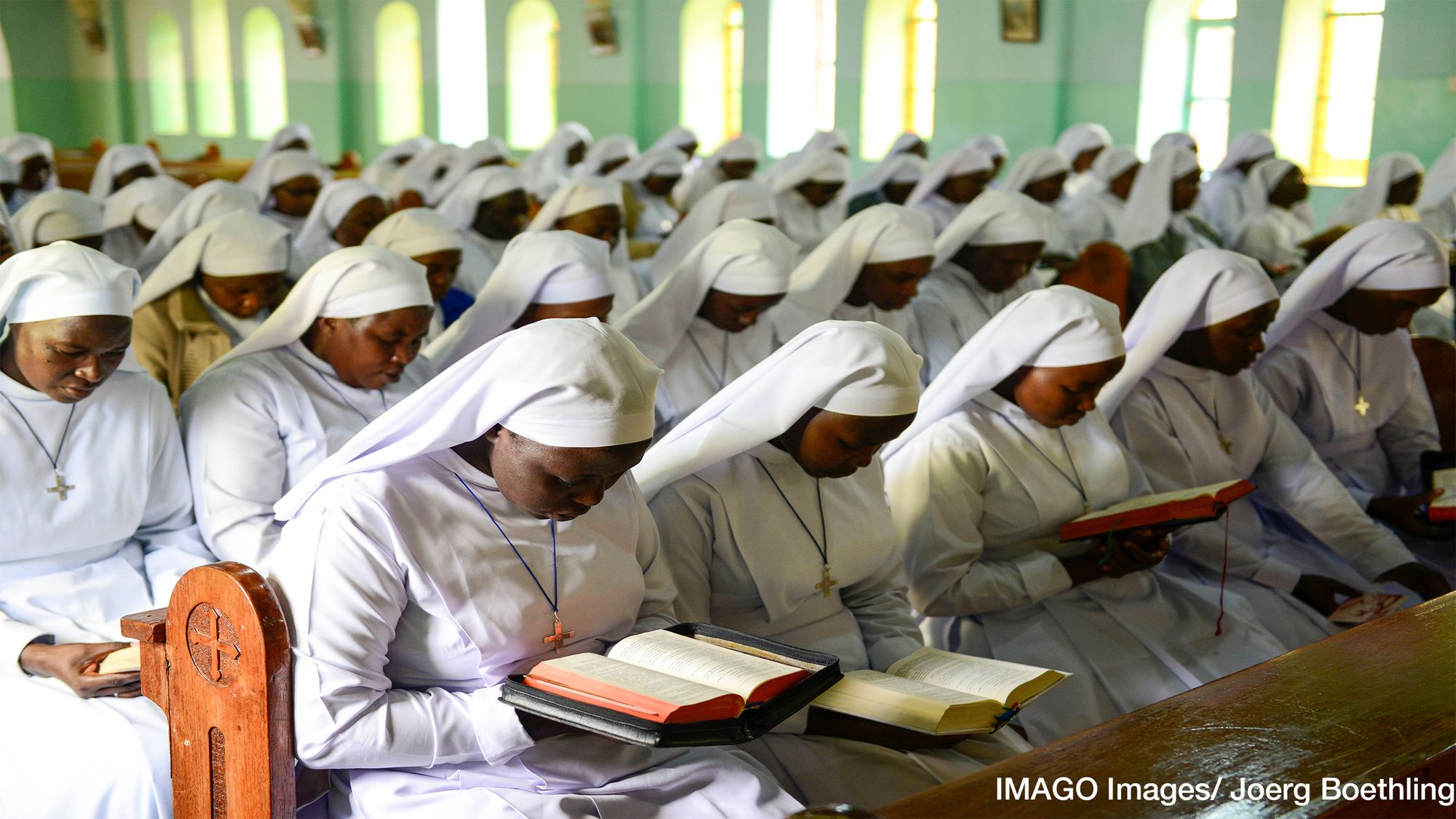 Cooperation in the Name of God? Experimental Evidence from Ghana and Tanzania