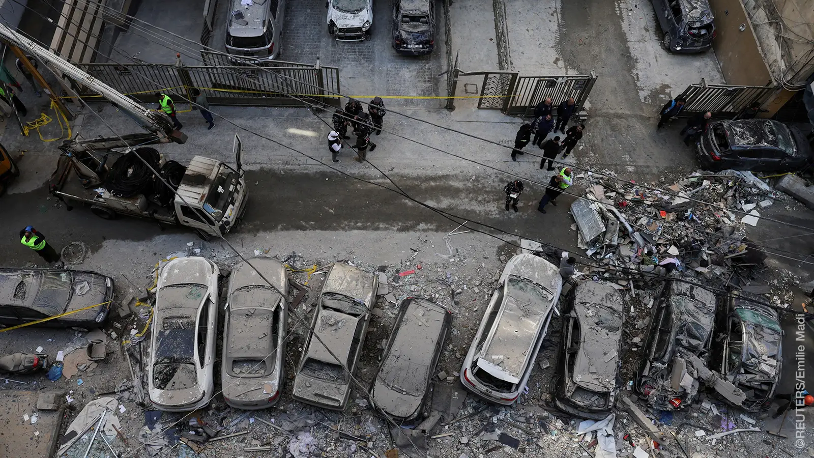 Debris and damaged vehicles at the site of an Israeli strike on an apartment building, in central Beirut, Lebanon, March 11, 2026, following an escalation between Hezbollah and Israel amid the U.S.-Israeli conflict with Iran. 