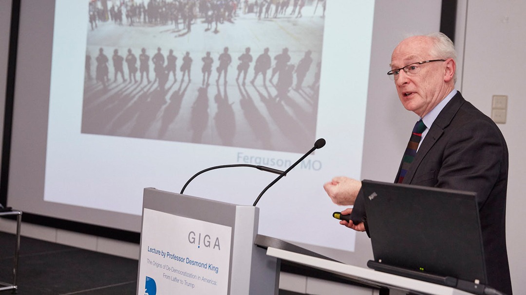 Picture of Prof. Desmond King at the Speaker's desk