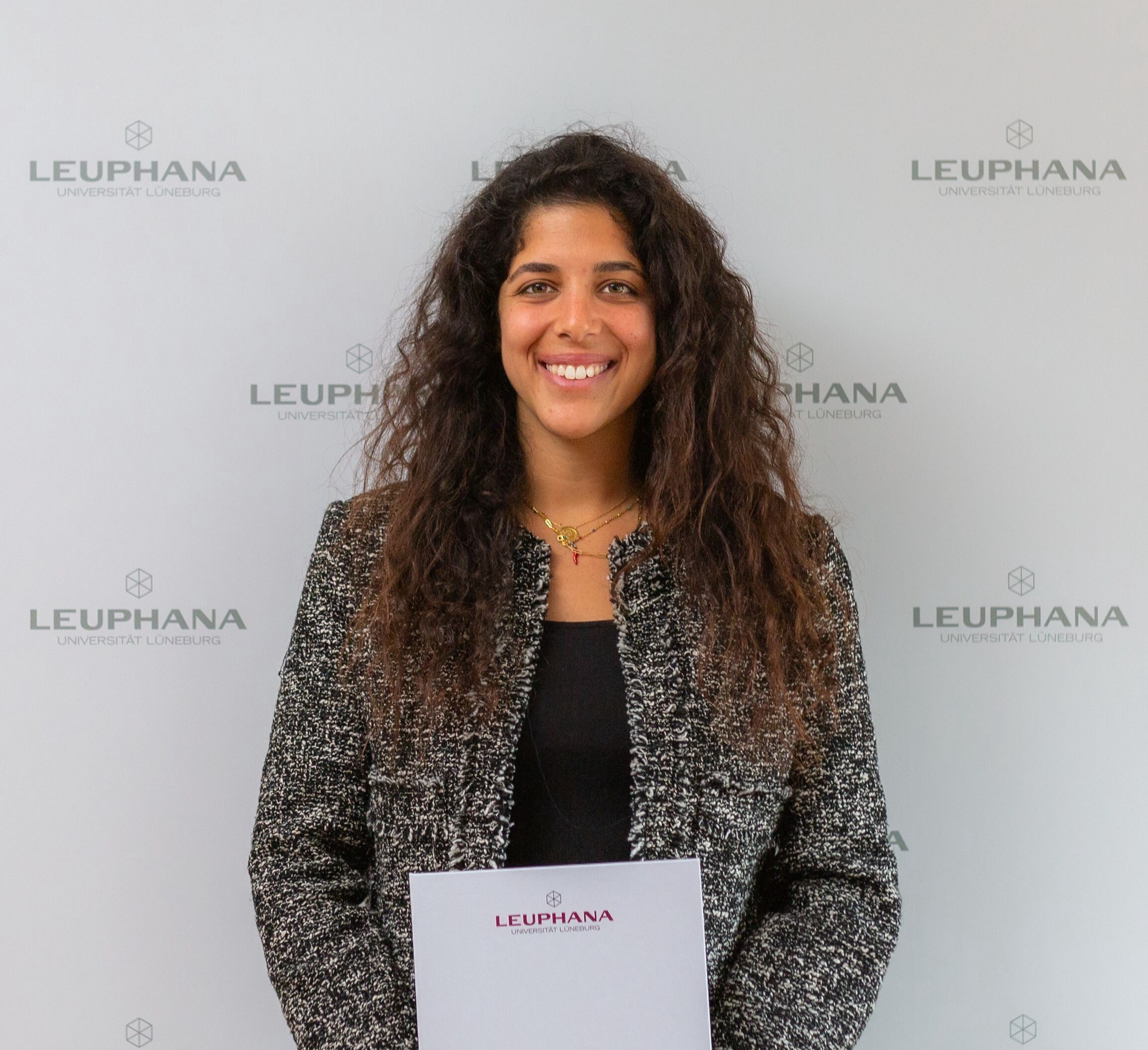 Dr Hana Attia with her certificate of appointment.